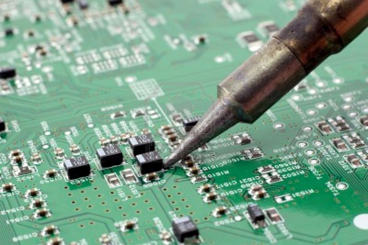 2047119-technician-repairing-electronic-circuit-board-with-soldering-iron-1